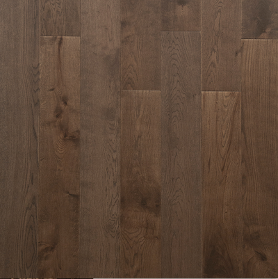 Close-up of dark brown wooden flooring with visible grain and texture.